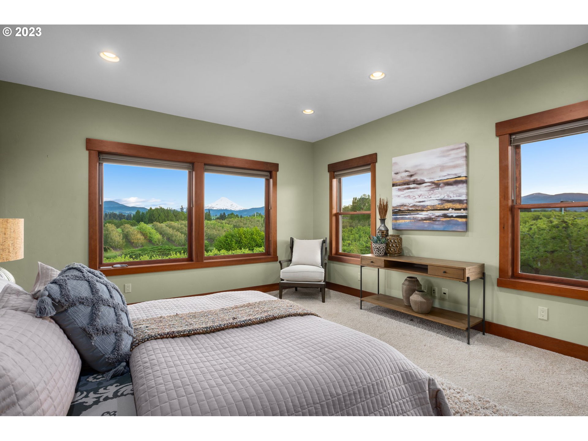 1575 Nunamaker Road Hood River, OR 97031 - Photo 18 of 48 a bedroom with a bed and large windows