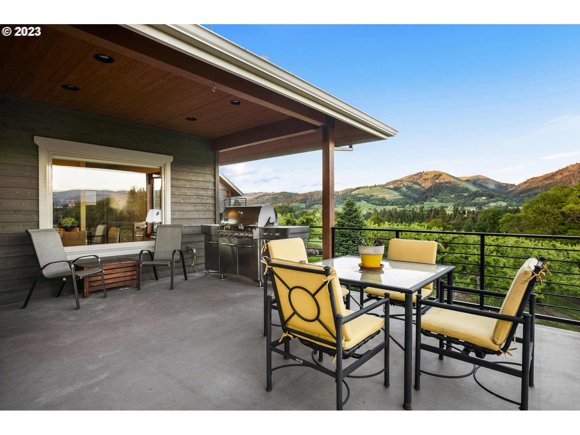 1575 Nunamaker Road Hood River, OR 97031 - Photo 33 of 48 a patio with table and chairs