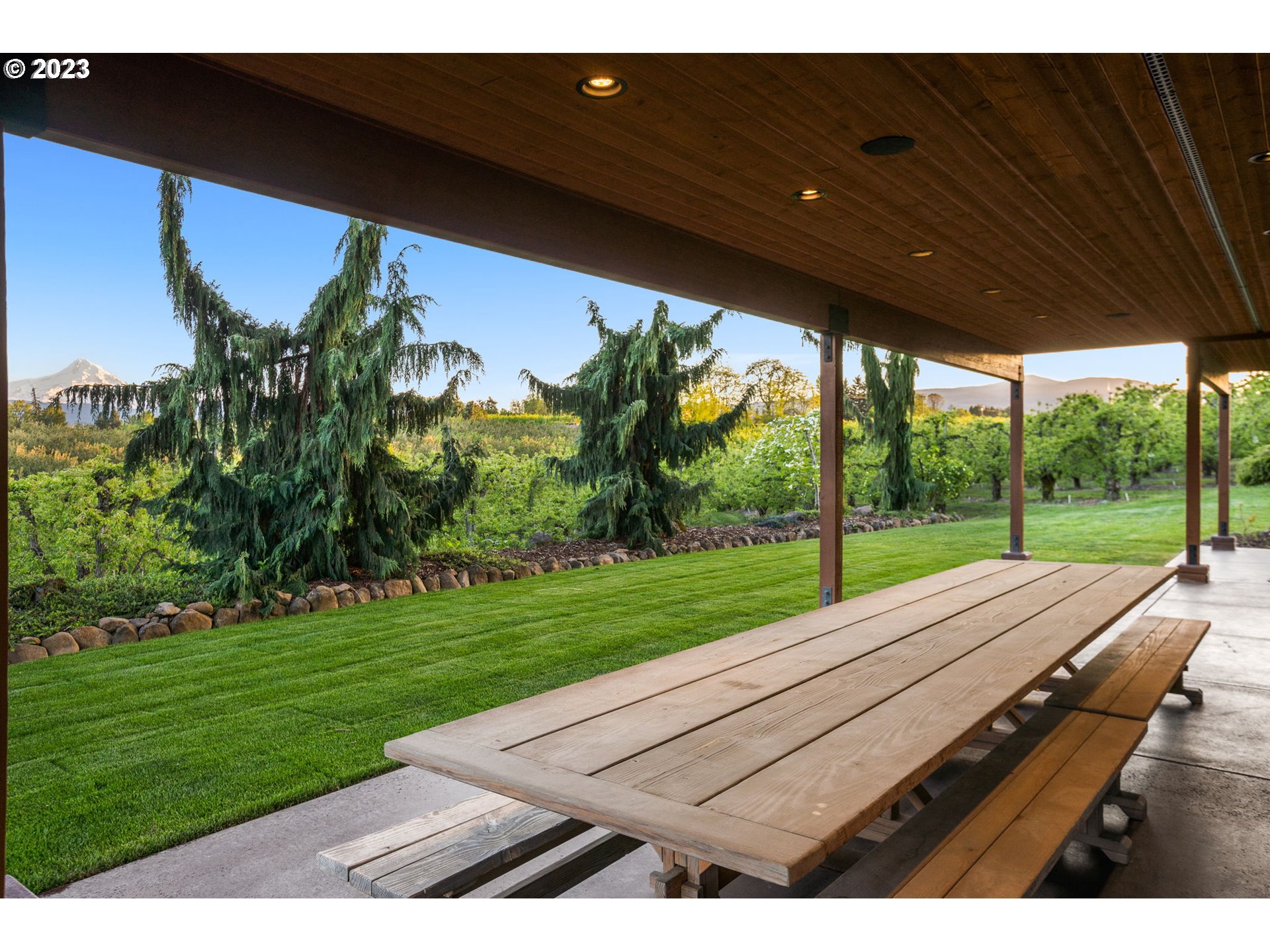 1575 Nunamaker Road Hood River, OR 97031 - Photo 38 of 48 a view of a patio with a table and chairs