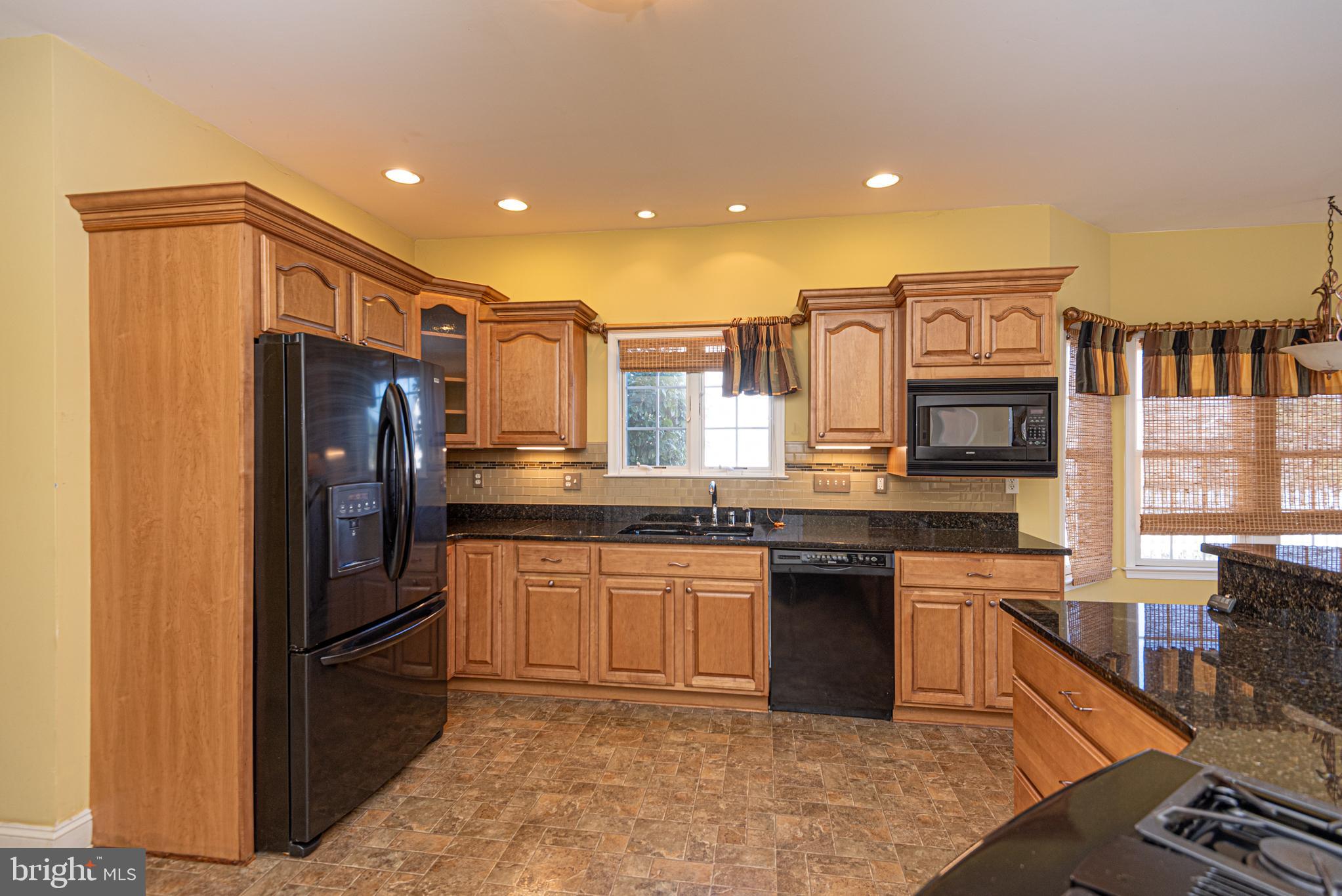 6023 Tarry Town Road Salisbury, MD 21801 - Photo 9 of 61 Warm, inviting kitchen with modern finishes.