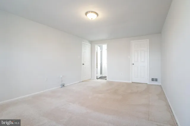 a bathroom with a toilet sink and window