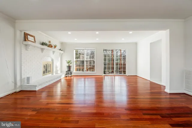 a view of a kitchen with a table and chairs