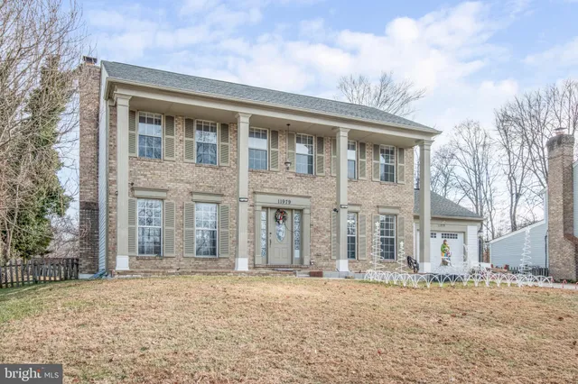 front view of a house with a dry yard