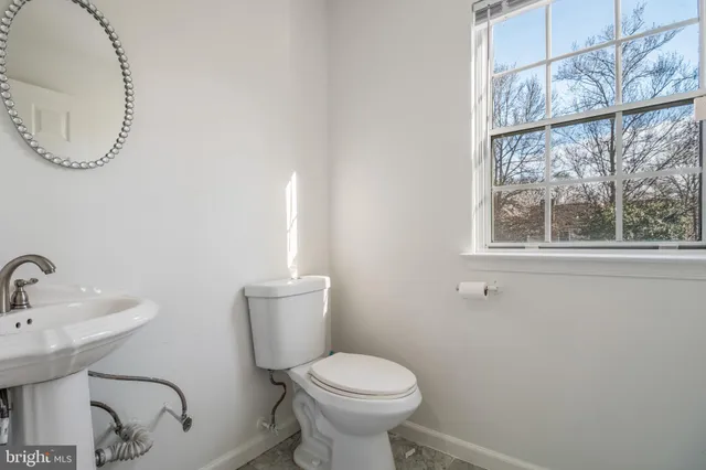 a kitchen with cabinets appliances a sink and a window