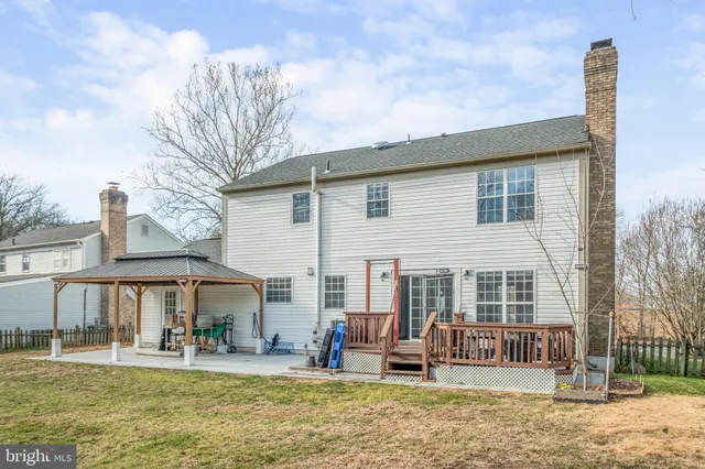 a front view of a house with a yard outdoor seating and barbeque oven