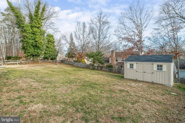 a view of a house with a yard and garage