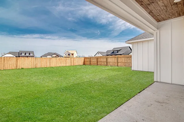a view of a house with a big yard