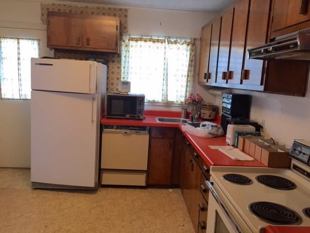 20 Sargent Avenue Stratton, ME 04982 - Photo 3 of 12 Kitchen with door leading to back deck.