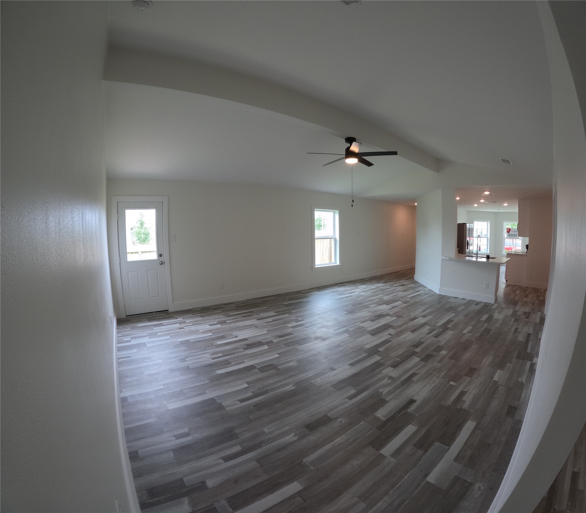 8419 Hannah Rd Cove Cove, TX 77523 - Photo 22 of 28 a view of an empty room with window and wooden floor