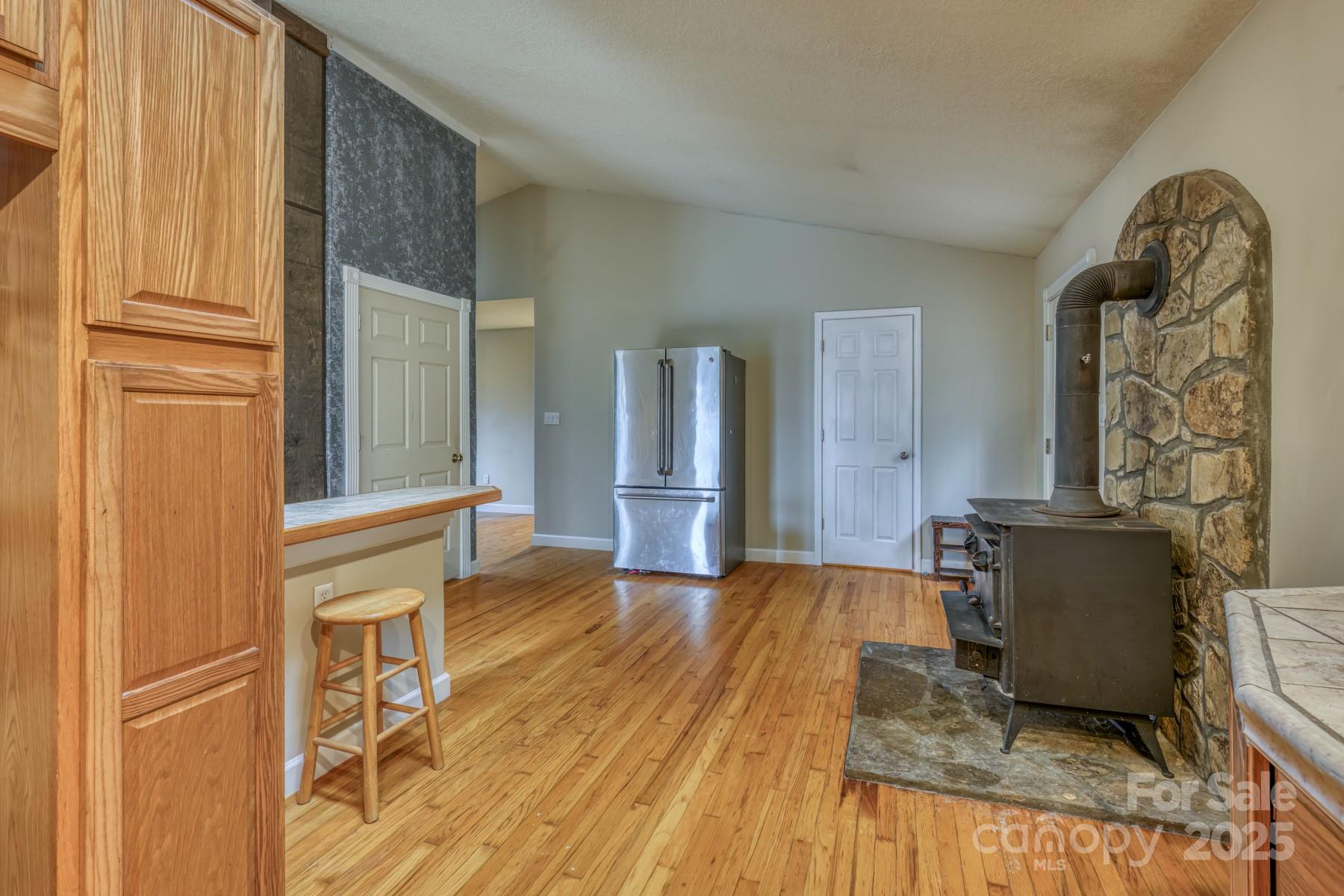 534 Parson Branch Road Green Mountain, NC 28740 - Photo 12 of 47 a living room with a fireplace furniture and a window