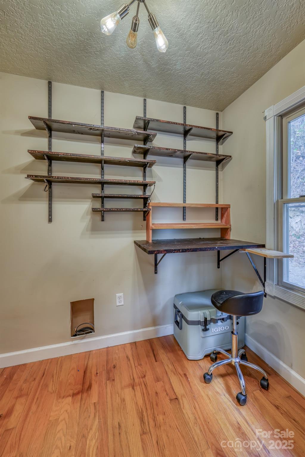 534 Parson Branch Road Green Mountain, NC 28740 - Photo 13 of 47 a room with gym equipment and wooden floor