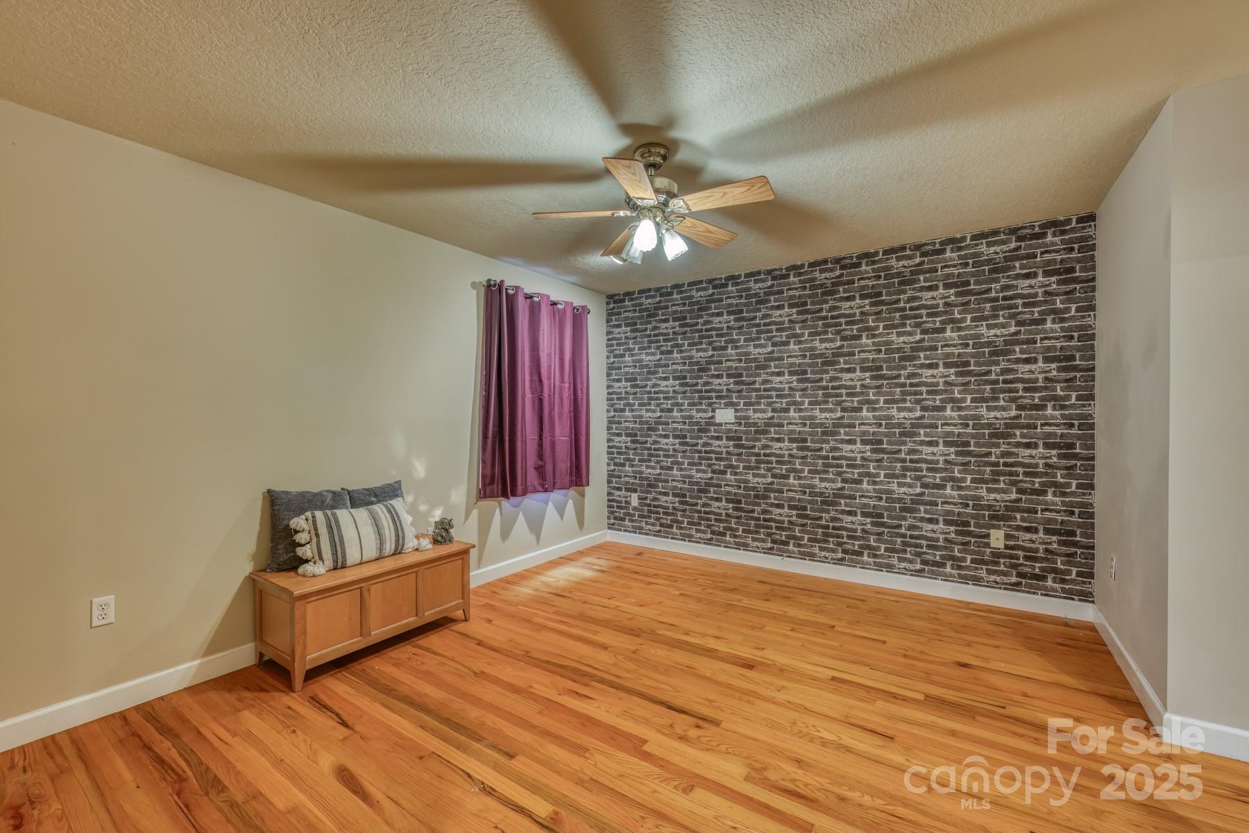 534 Parson Branch Road Green Mountain, NC 28740 - Photo 18 of 47 a view of livingroom with hardwood floor and a ceiling fan
