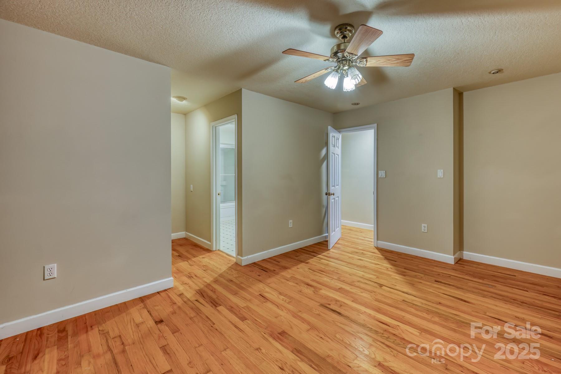 534 Parson Branch Road Green Mountain, NC 28740 - Photo 19 of 47 a view of an empty room with wooden floor