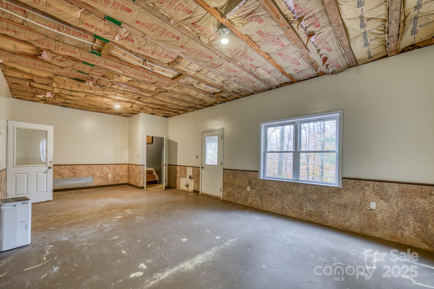 534 Parson Branch Road Green Mountain, NC 28740 - Photo 26 of 47 a view of an empty room with a window