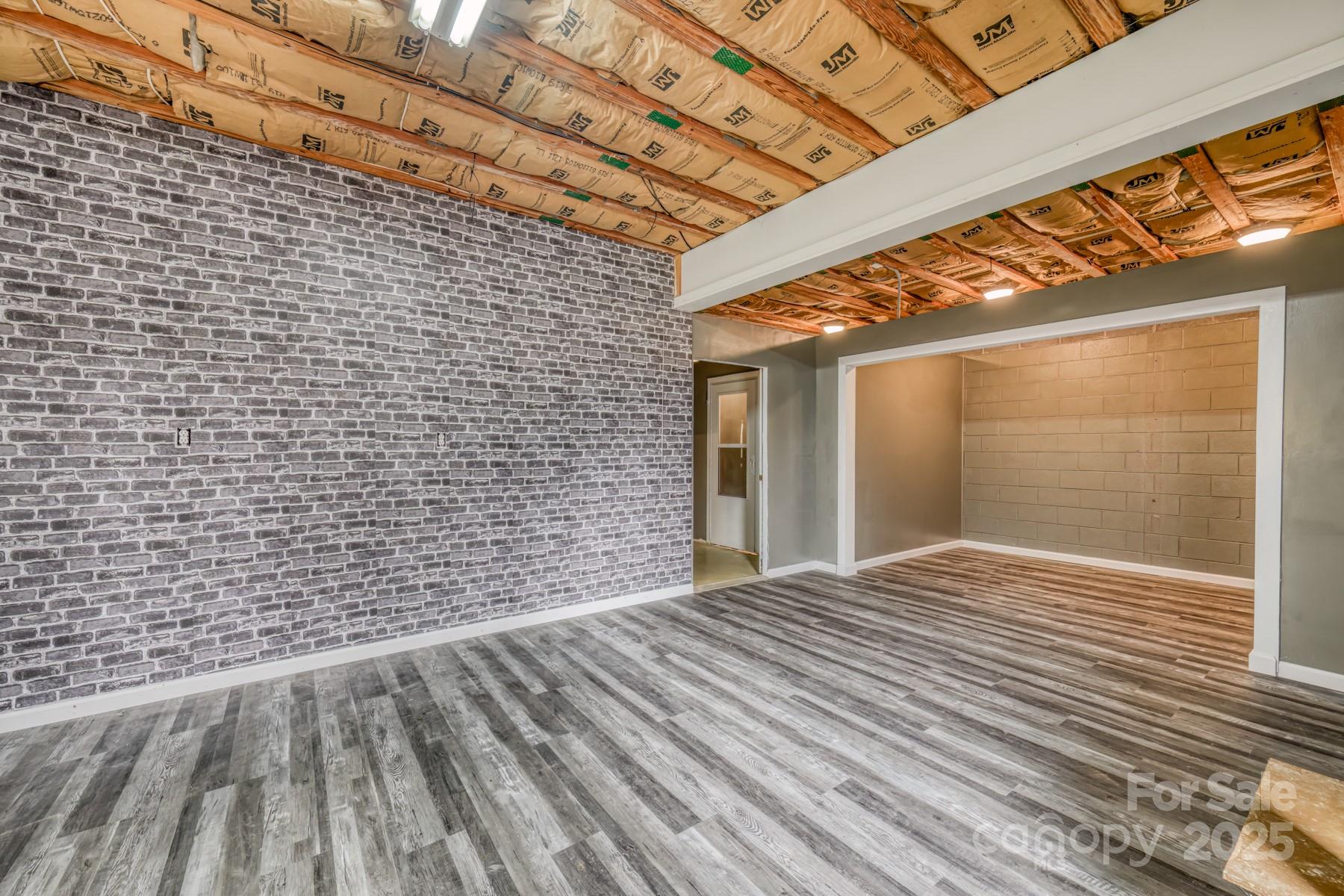 534 Parson Branch Road Green Mountain, NC 28740 - Photo 33 of 47 a view of empty room with wooden floor