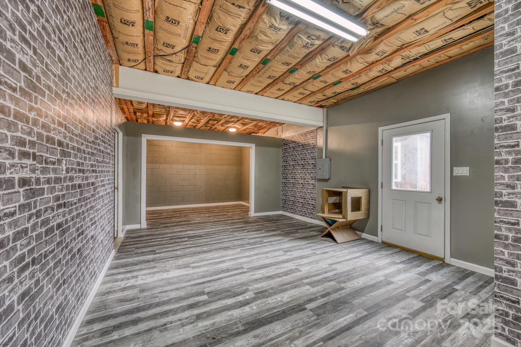 534 Parson Branch Road Green Mountain, NC 28740 - Photo 34 of 47 a view of a room with wooden floor and a window