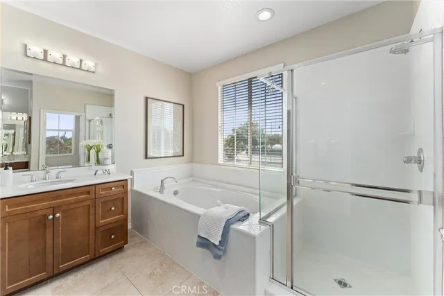 a bedroom with a bed and a table in it