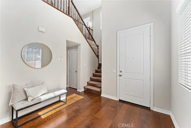 a view of a room with wooden floor and staircase