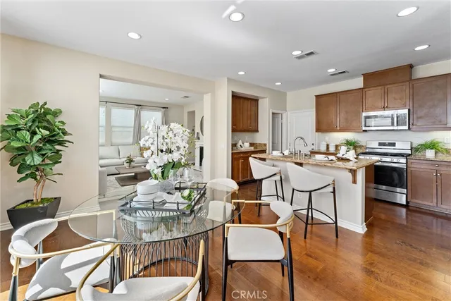 a kitchen with a table and chairs in it