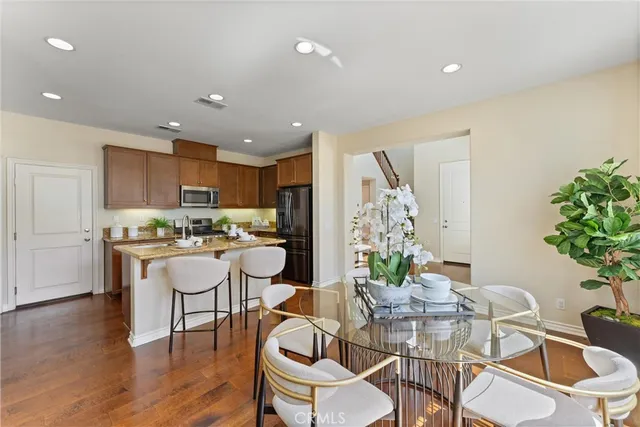 a kitchen with a table and chairs