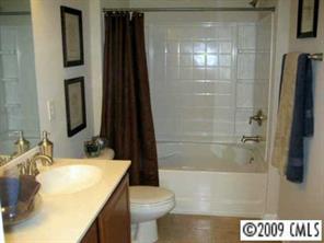 5699 Stafford Road, Unit 72 Charlotte, NC 28215 - Photo 7 of 8 a bathroom with a sink and a mirror