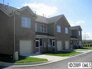 5699 Stafford Road, Unit 72 Charlotte, NC 28215 - Photo 8 of 8 a front view of a house with a yard