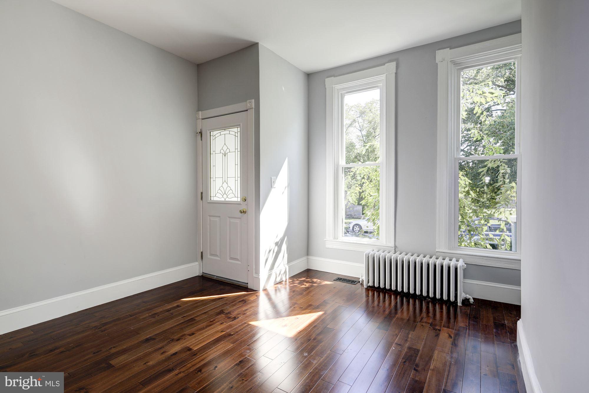 3234 Keswick Road Baltimore, MD 21211 - Photo 2 of 42 Sunlit Living Room w/ 2 New Windows!