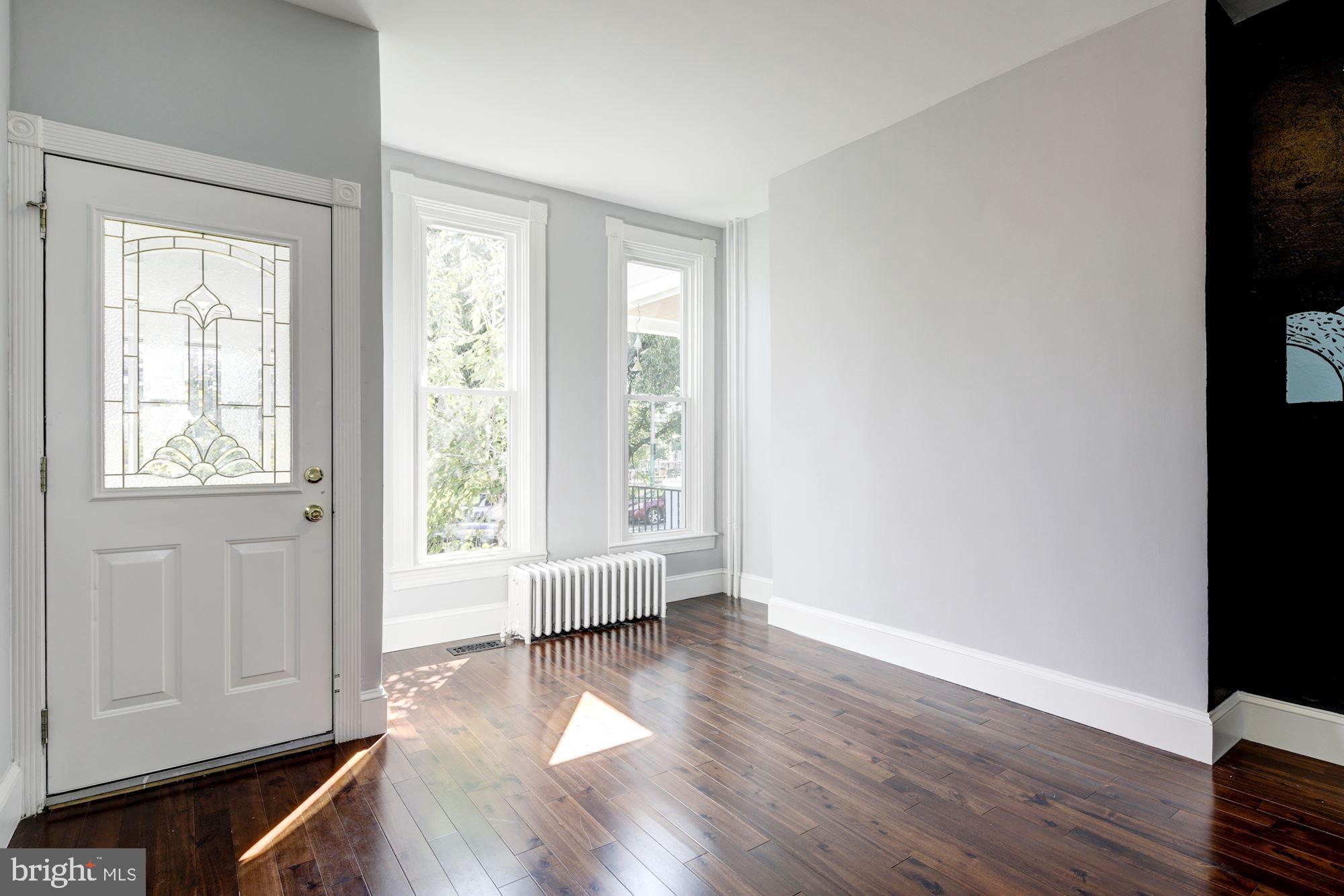 3234 Keswick Road Baltimore, MD 21211 - Photo 3 of 42 Sunlit Living Room w/ 2 New Windows!