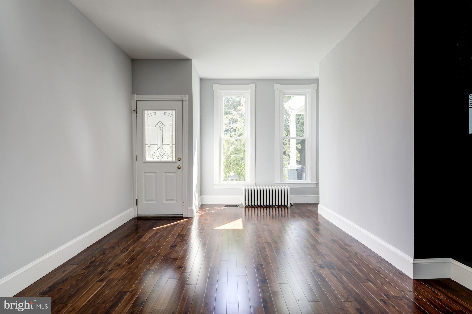 3234 Keswick Road Baltimore, MD 21211 - Photo 4 of 42 Sunlit Living Room w/ 2 New Windows!