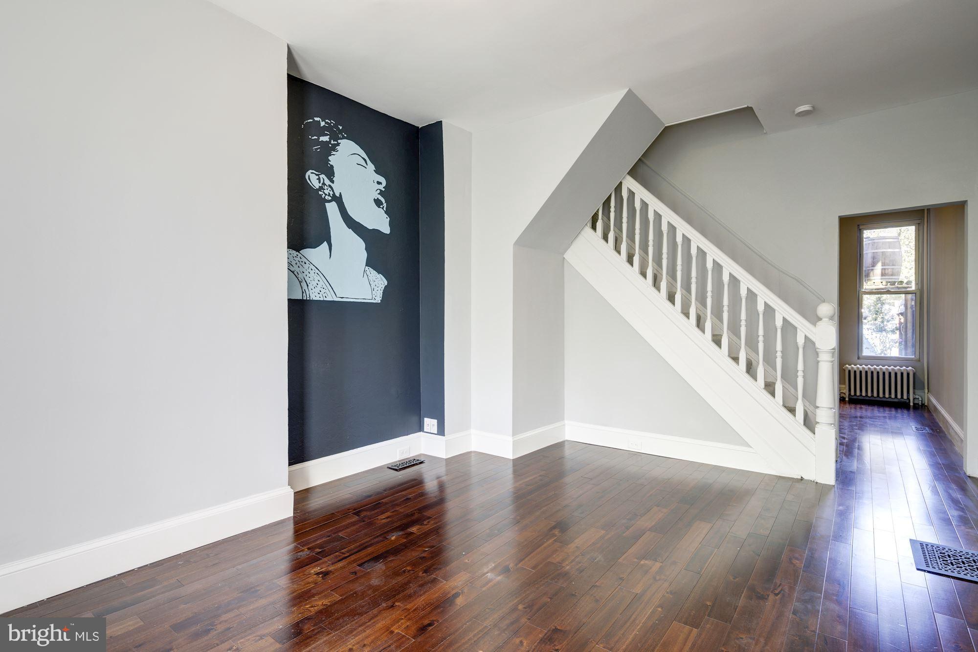 3234 Keswick Road Baltimore, MD 21211 - Photo 8 of 42 Sunlit Living Room w/ Gleaming Hardwood Floors