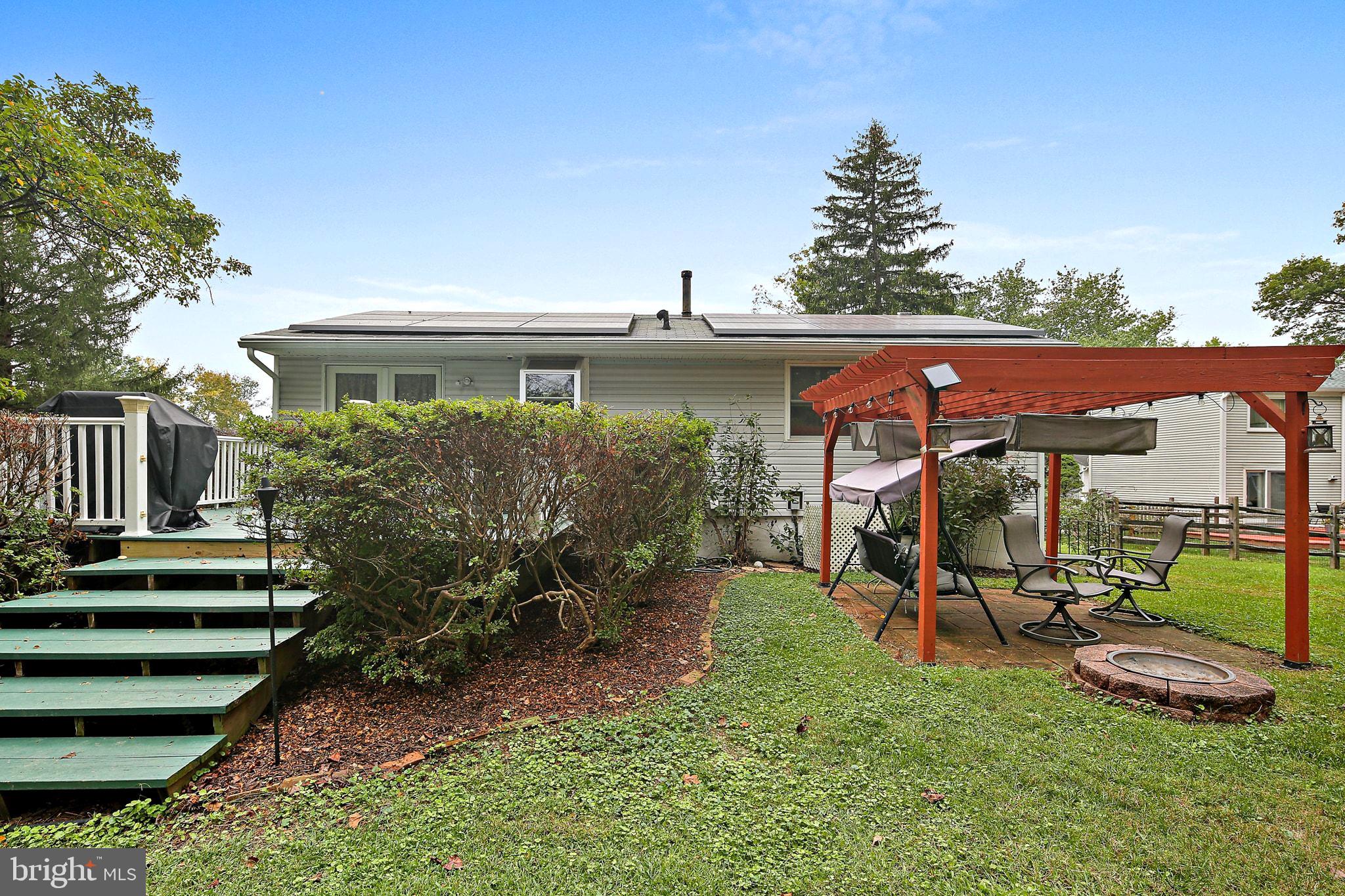 5033 Three Kings Lane Columbia, MD 21044 - Photo 17 of 37 a view of a backyard with plants and a patio
