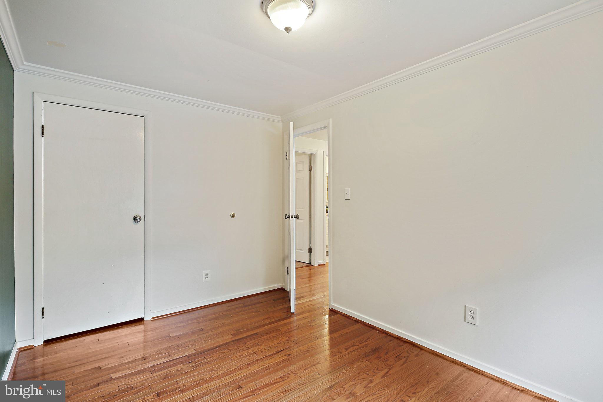 5033 Three Kings Lane Columbia, MD 21044 - Photo 25 of 37 a view of an empty room with wooden floor