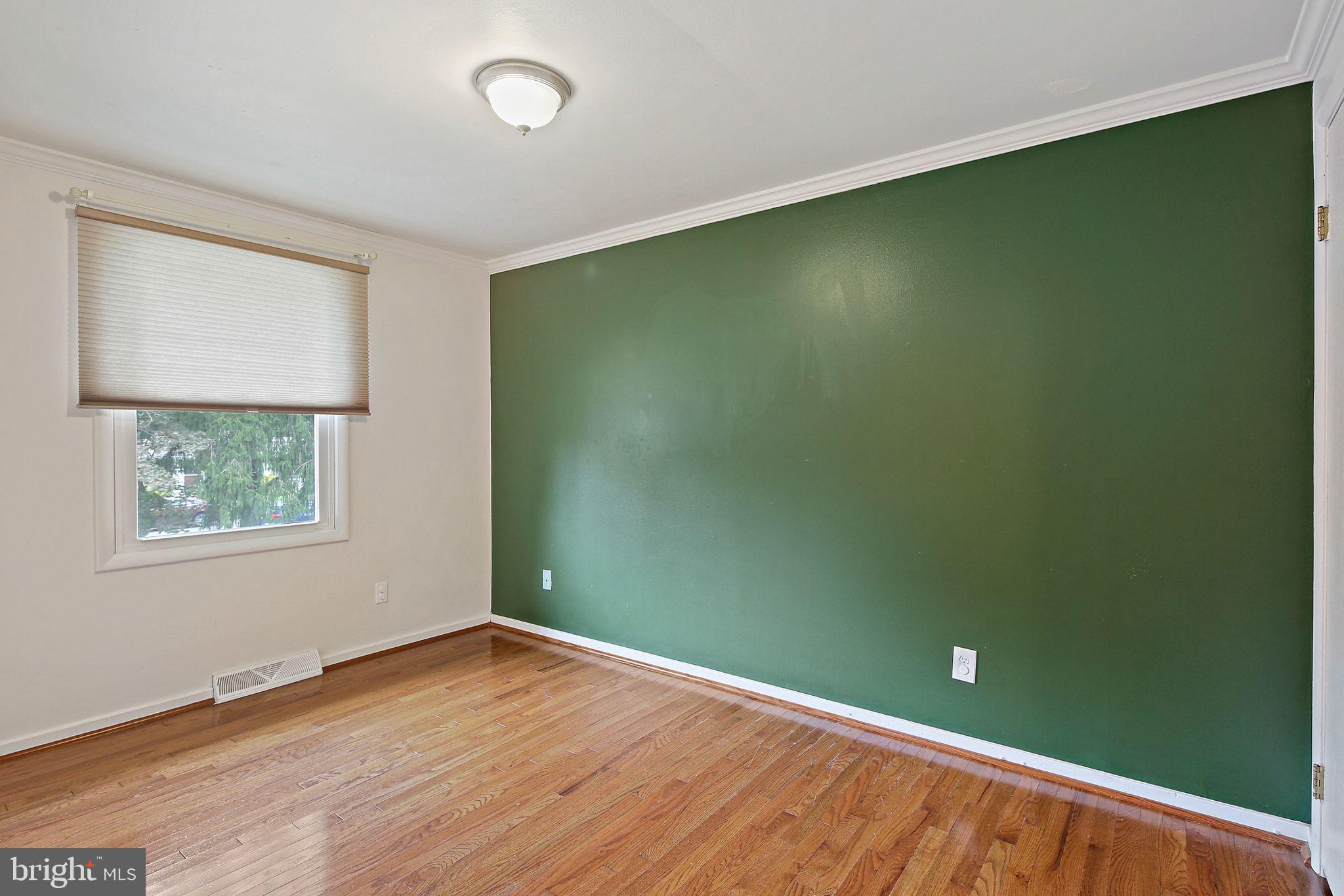 5033 Three Kings Lane Columbia, MD 21044 - Photo 26 of 37 an empty room with wooden floor and windows