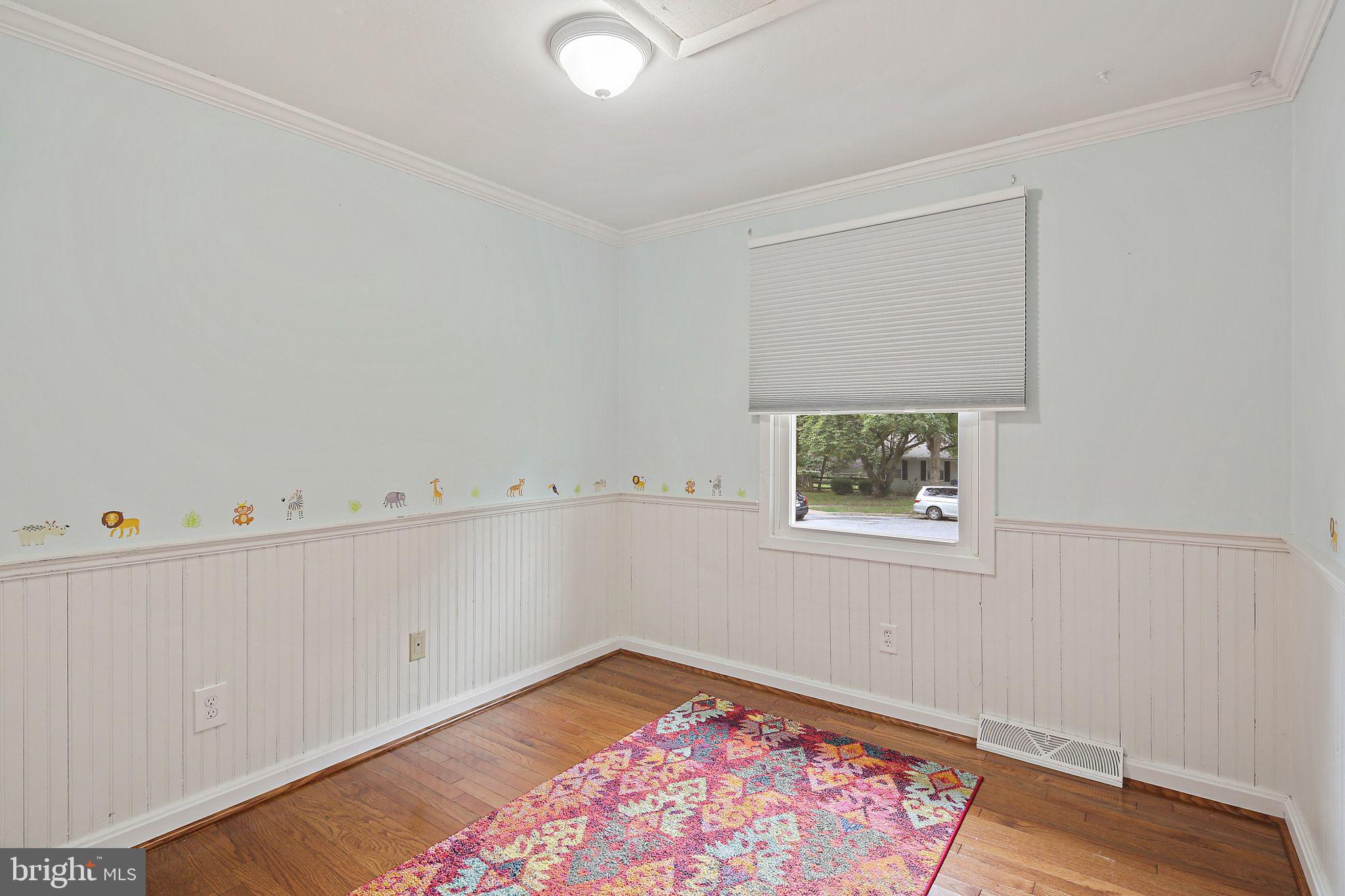 5033 Three Kings Lane Columbia, MD 21044 - Photo 28 of 37 an entryway with wooden floor and cabinet