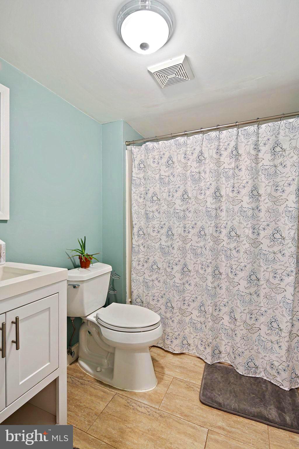 5033 Three Kings Lane Columbia, MD 21044 - Photo 34 of 37 a bathroom with a granite countertop toilet and a sink