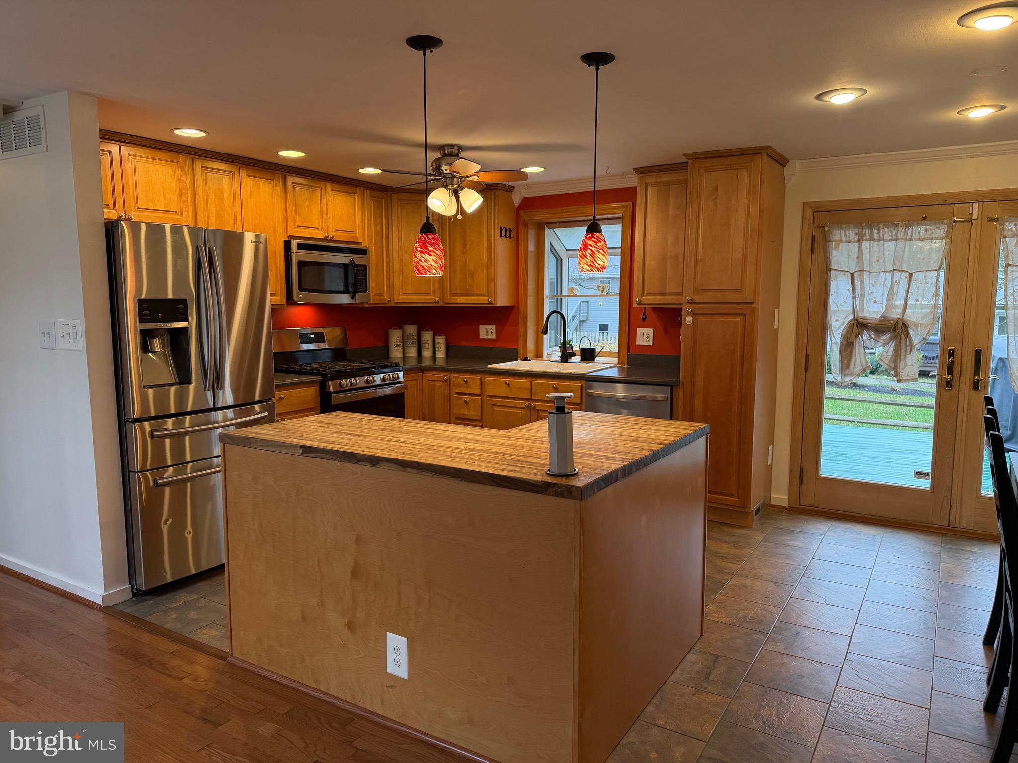 5033 Three Kings Lane Columbia, MD 21044 - Photo 7 of 37 a kitchen with stainless steel appliances granite countertop a refrigerator a oven and a sink