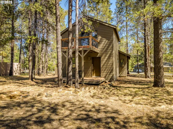 a view of trees from a balcony
