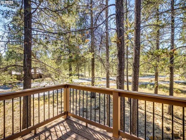 a view of a patio with a table and chairs and potted plants