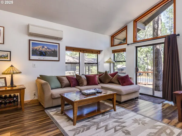 a living room with furniture or couch and a large window