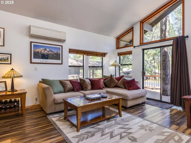 a living room with furniture or couch and a large window