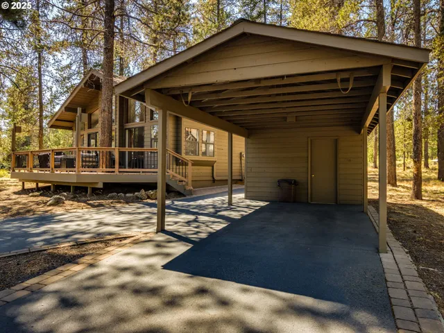 a view of a house with wooden fence