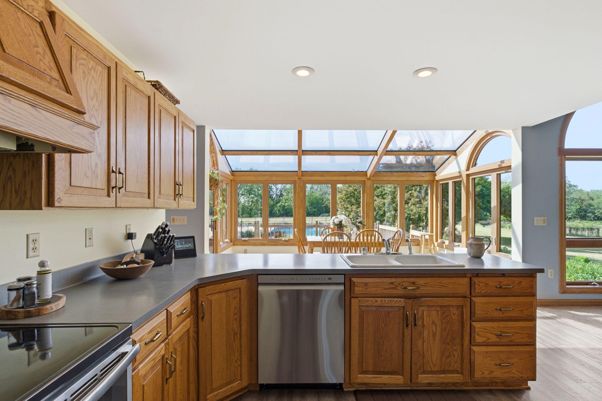 W350S1951 Waterville Road Ottawa, WI 53066 - Photo 12 of 60 Kitchen overlooking Four Season Room