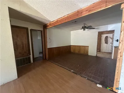 a view of a kitchen with a sink and cabinets