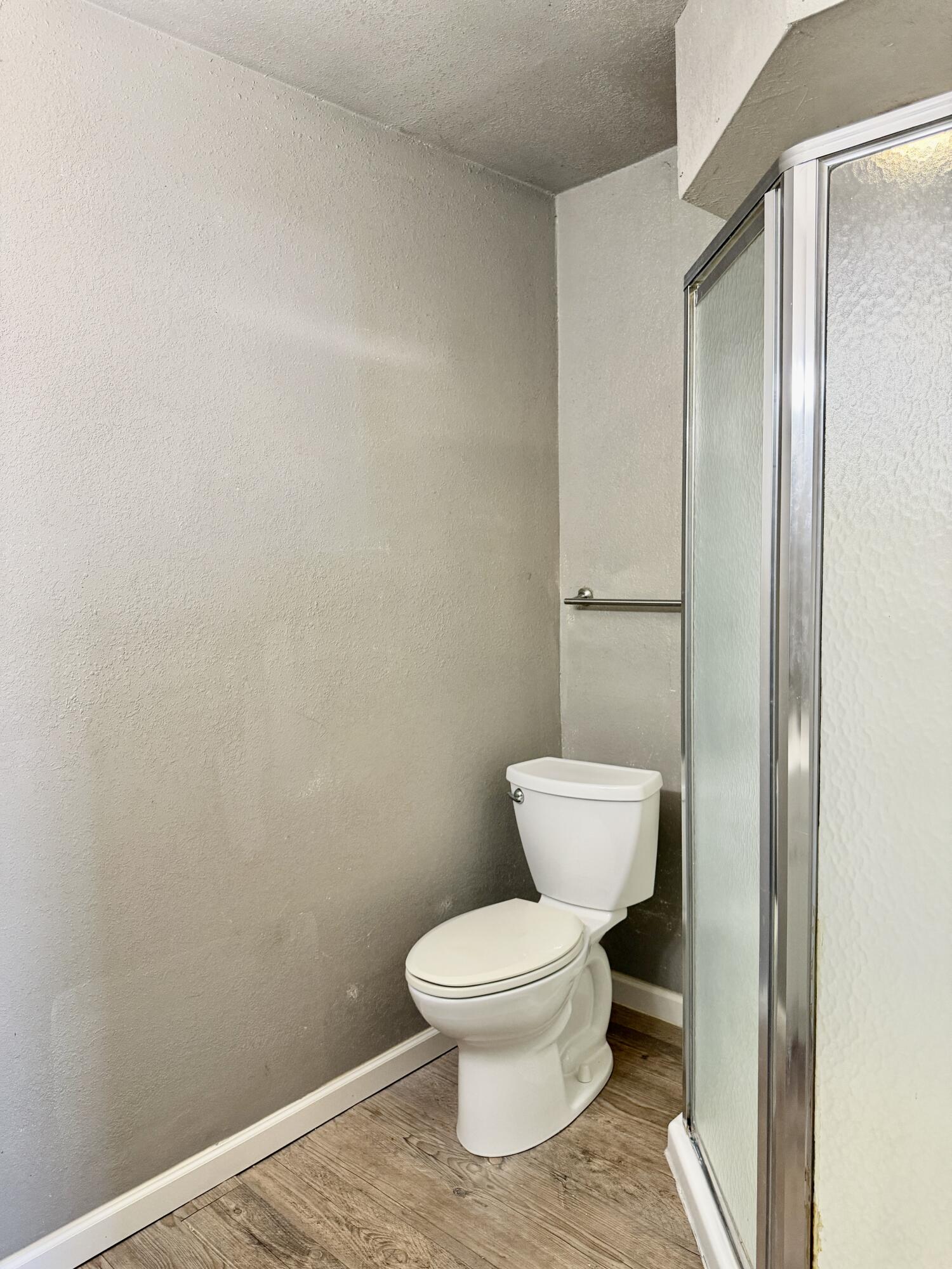 4818 36th Street Lubbock, TX 79414 - Photo 20 of 25 a white toilet sitting next to a bathroom sink