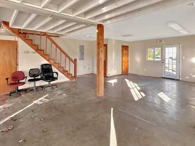 a view of a livingroom with car parked