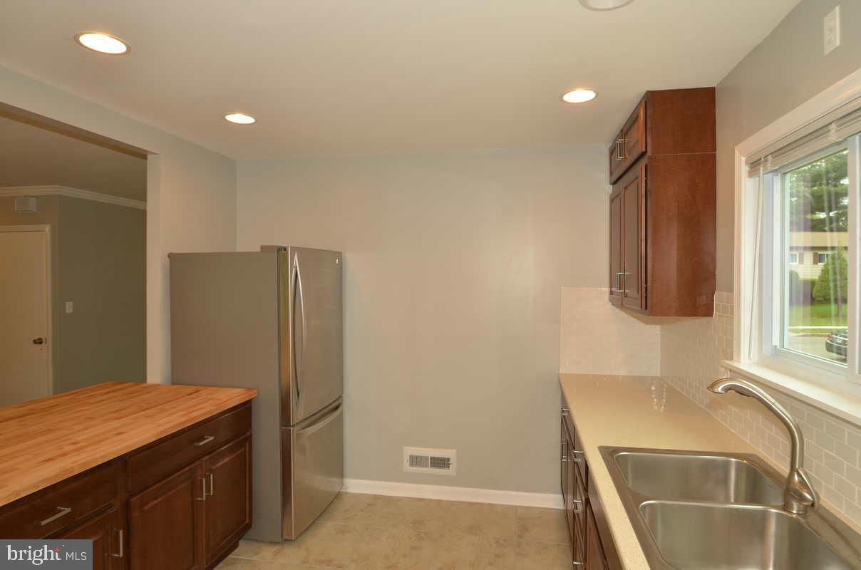 6104 Chanceford Road Baltimore, MD 21228 - Photo 8 of 17 a room with a sink and a refrigerator