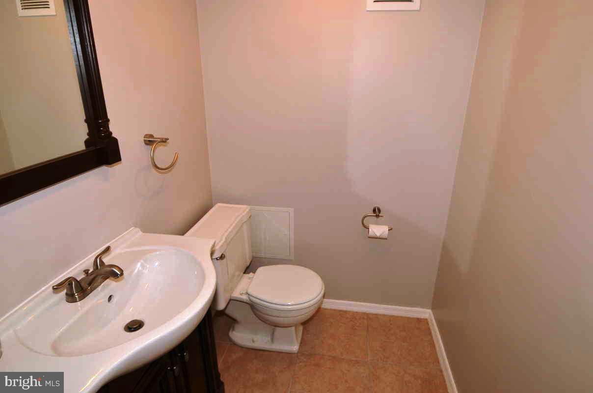 6104 Chanceford Road Baltimore, MD 21228 - Photo 9 of 17 a bathroom with a sink and a toilet