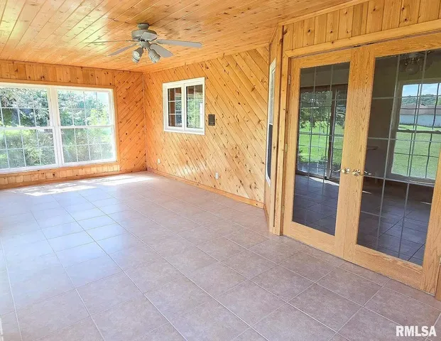 a view of an empty room with a balcony