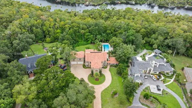 a view of a livingroom with furniture and a flat screen tv