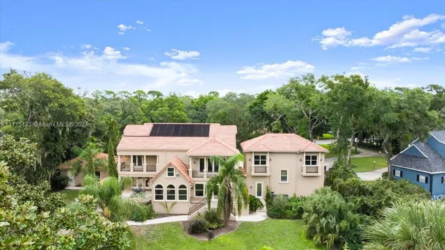 a spacious bedroom with a bed and a large window